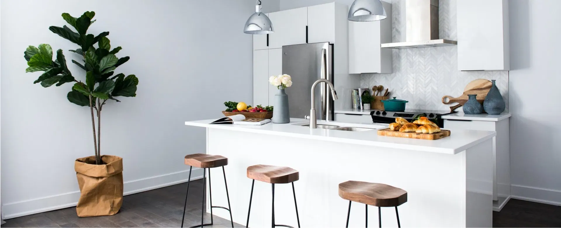 Bright modern kitchen renovation with a warm island and natural details