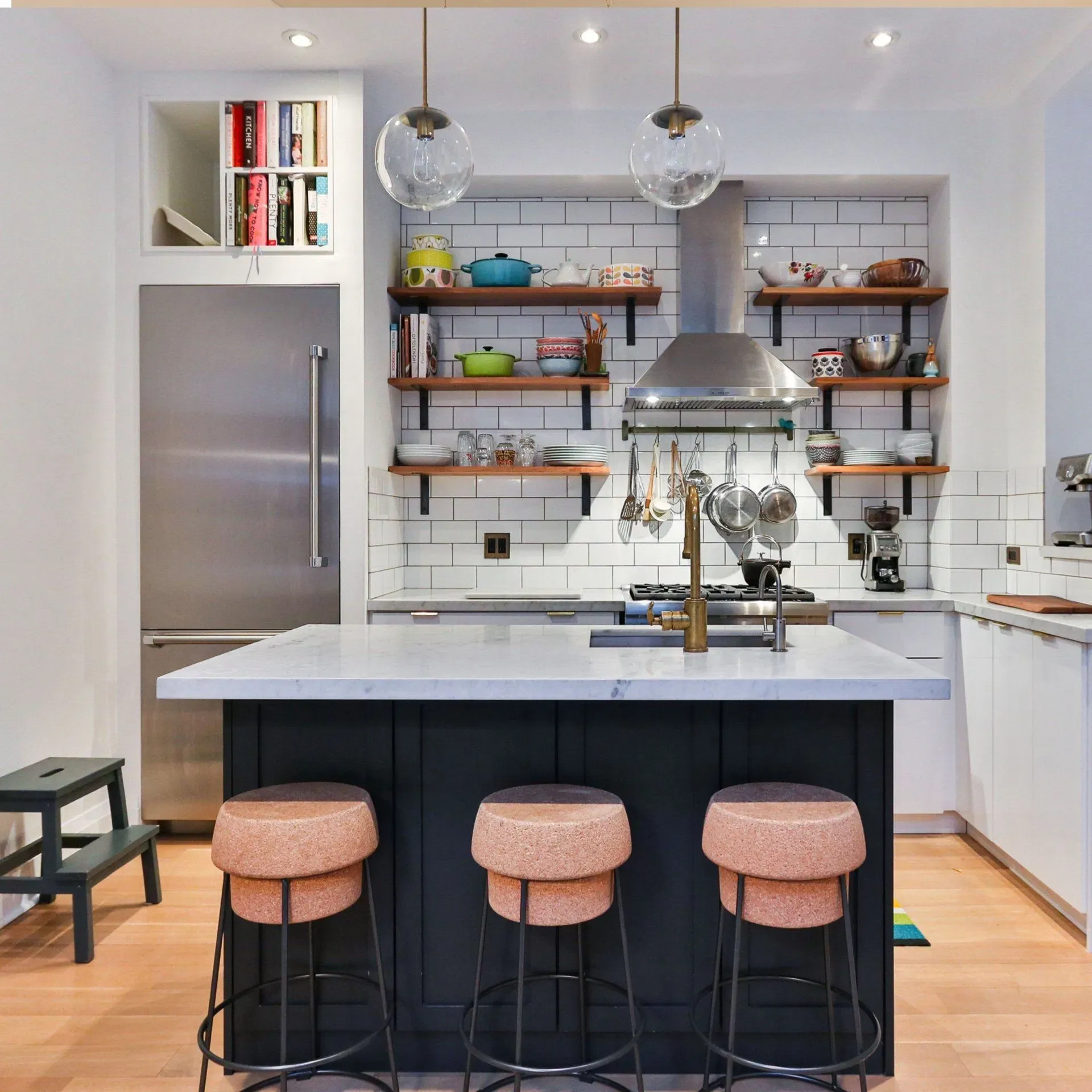 Open-plan kitchen renovation with dark island